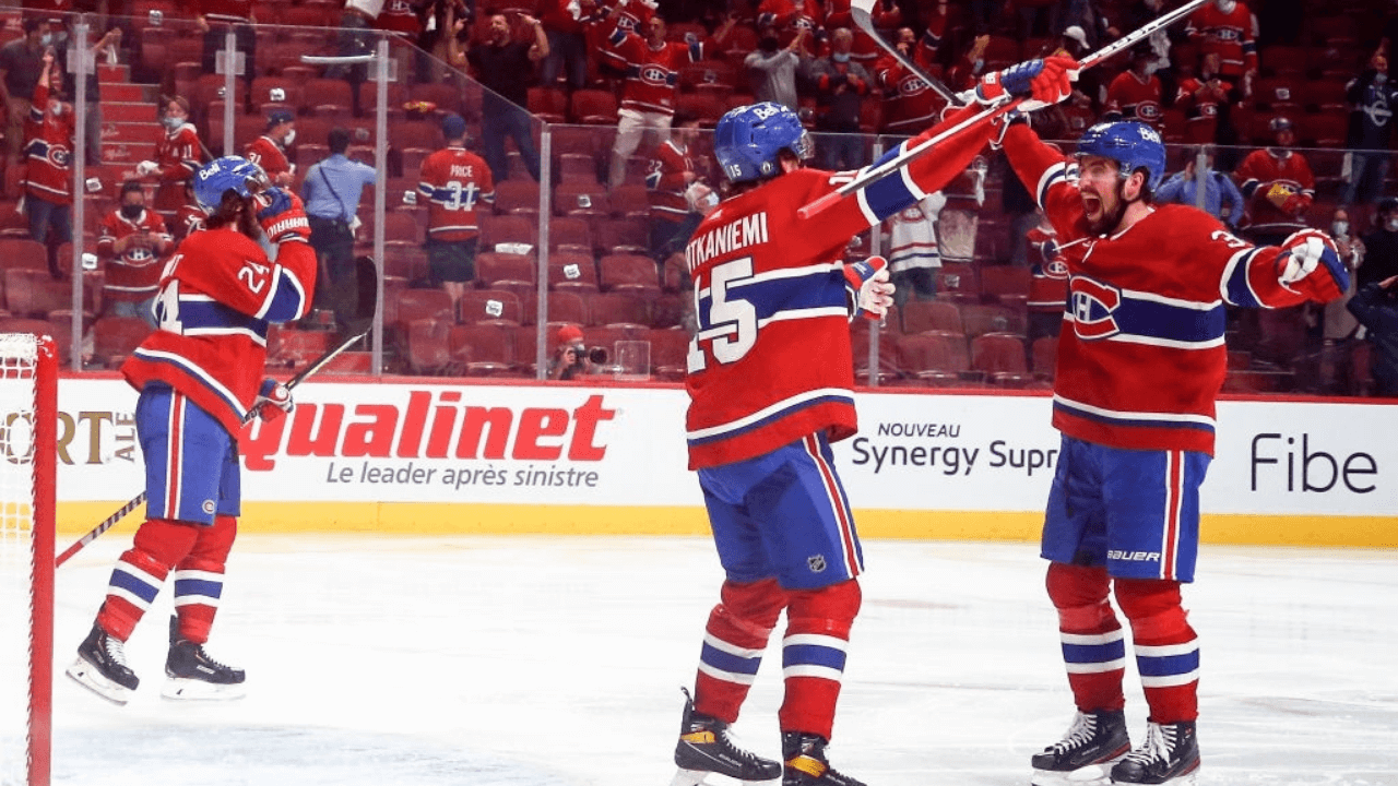MONTREAL, QUEBEC - JUNE 24: Jesperi Kotkaniemi #15 and Erik Gustafsson #32 of the Montreal Canadiens celebrate the game-winning overtime goal scored by Artturi Lehkonen (not pictured) against the Vegas Golden Knights in Game Six of the Stanley Cup Semifinals of the 2021 Stanley Cup Playoffs at Bell Centre on June 24, 2021 in Montreal, Quebec. (Photo by Vaughn Ridley/Getty Images)