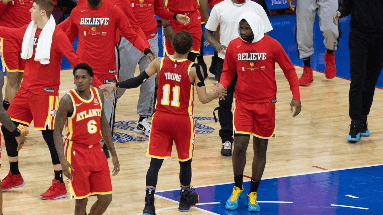 Jun 16, 2021; Philadelphia, Pennsylvania, USA; Atlanta Hawks guard Trae Young (11) is congratulated by team mates after scoring against the Philadelphia 76ers during the fourth quarter in game five of the second round of the 2021 NBA Playoffs at Wells Fargo Center. Mandatory Credit: Bill Streicher-USA TODAY Sports