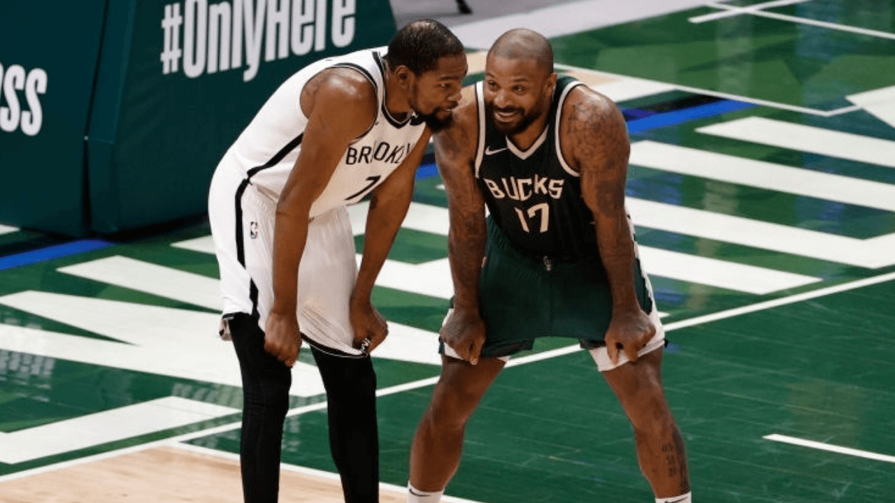 MILWAUKEE, WI - MAY 2: Kevin Durant #7 of the Brooklyn Nets talks with P.J. Tucker #17 of the Milwaukee Bucks during the game on May 2, 2021 at the Fiserv Forum Center in Milwaukee, Wisconsin. NOTE TO USER: User expressly acknowledges and agrees that, by downloading and or using this Photograph, user is consenting to the terms and conditions of the Getty Images License Agreement. Mandatory Copyright Notice: Copyright 2021 NBAE (Photo by Kamil Krzaczynski/NBAE via Getty Images).