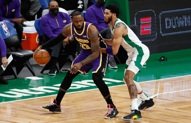 Jan 30, 2021; Boston, Massachusetts, USA; Los Angeles Lakers forward LeBron James (23) against Boston Celtics forward Jayson Tatum (0) during the second quarter at TD Garden.