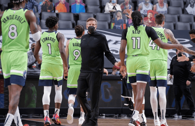 SACRAMENTO, CA - APRIL 21: Head coach Chris Finch of the Minnesota Timberwolves high fives his team during the game against the Sacramento Kings on April 21, 2021 at Golden 1 Center in Sacramento, California. NOTE TO USER: User expressly acknowledges and agrees that, by downloading and or using this photograph, User is consenting to the terms and conditions of the Getty Images Agreement. Mandatory Copyright Notice: Copyright 2021 NBAE (Photo by Rocky Widner/NBAE via Getty Images)