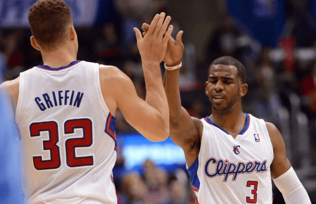 Dec 21, 2013; Los Angeles, CA, USA; Los Angeles Clippers point guard Chris Paul (3) and power forward Blake Griffin (32) high five in the second half of the game against the Denver Nuggets at Staples Center. The Clippers won 112-91. Mandatory Credit: Jayne Kamin-Oncea-USA TODAY Sports