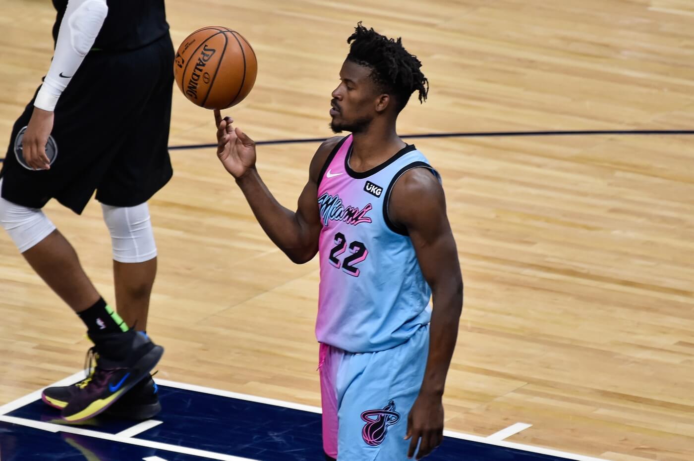 Apr 16, 2021; Minneapolis, Minnesota, USA; Miami Heat forward Jimmy Butler (22) spins the basketball on his finger during the fourth quarter against the Minnesota Timberwolves at Target Center. Mandatory Credit: Jeffrey Becker-USA TODAY Sports