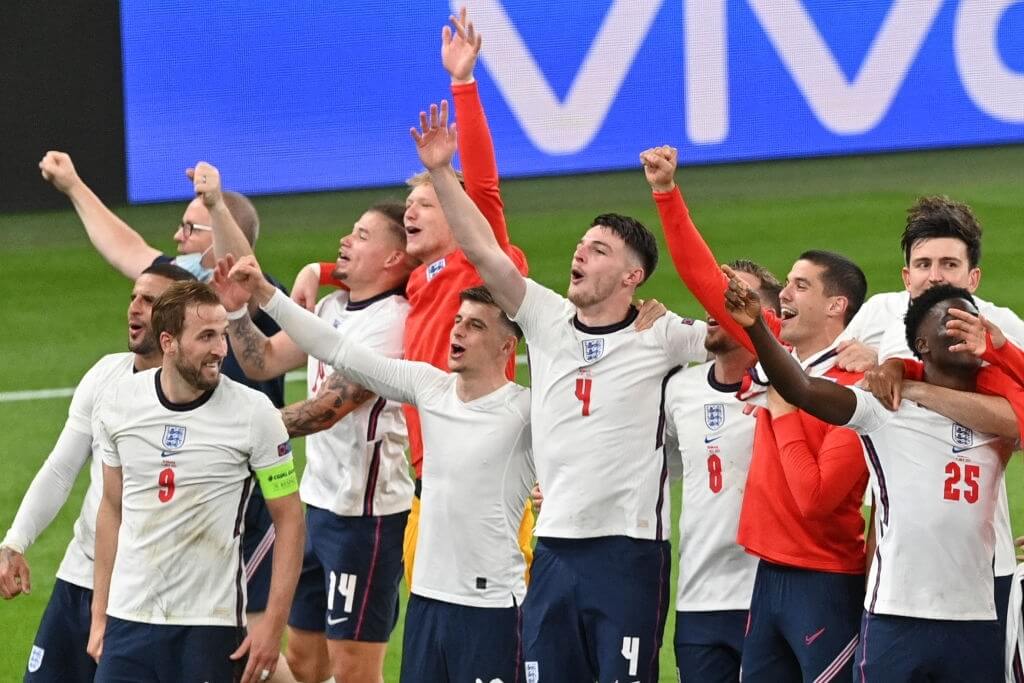 England's players celebrate after winning the UEFA EURO 2020 semi-final football match between England and Denmark at Wembley Stadium in London on July 7, 2021.