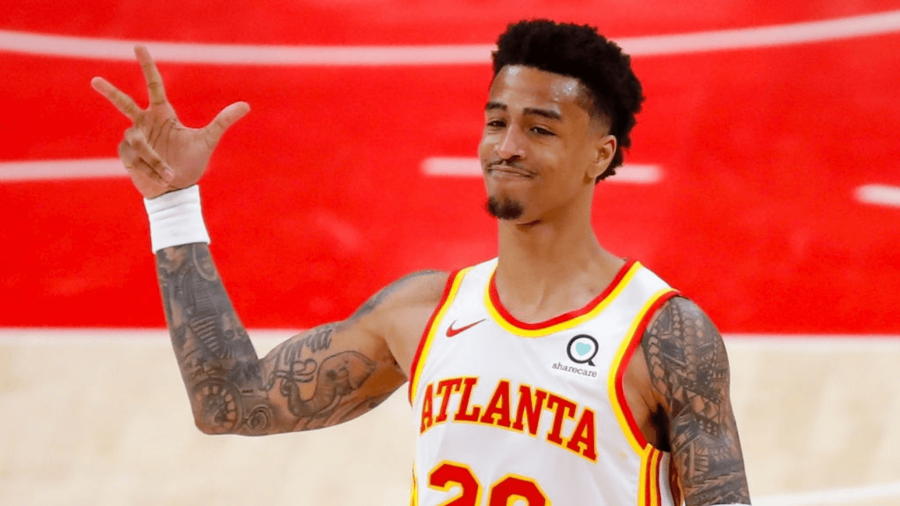 ATLANTA, GA - MAY 13: John Collins #20 of the Atlanta Hawks reacts after a three pointer during the second half against the Orlando Magic at State Farm Arena on May 13, 2021 in Atlanta, Georgia. NOTE TO USER: User expressly acknowledges and agrees that, by downloading and/or using this photograph, user is consenting to the terms and conditions of the Getty Images License Agreement. (Photo by Todd Kirkland/Getty Images)