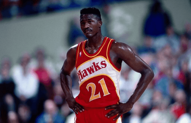 PORTLAND, OR - 1989: Dominique Wilkins #21 of the Atlanta Hawks looks on against the Portland Trailblazers at the Veterans Memorial Coliseum in Portland, Oregon circa 1989.