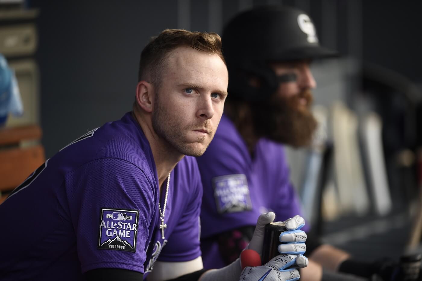 Jul 23, 2021; Los Angeles, California, USA; Colorado Rockies shortstop Trevor Story (27) looks on from the dugout in front of right fielder Charlie Blackmon (19) prior to the game against the Los Angeles Dodgers at Dodger Stadium. Mandatory Credit: Kelvin Kuo-USA TODAY Sports