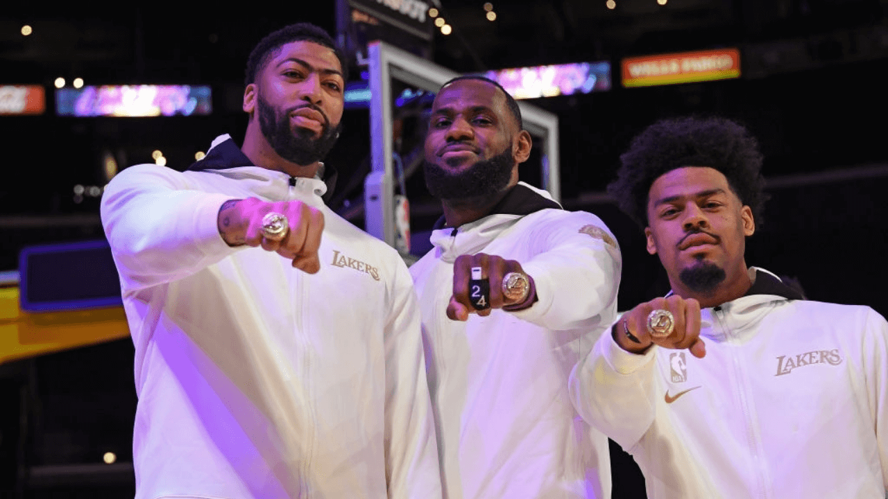 LOS ANGELES, CA - DECEMBER 22: Anthony Davis #3, LeBron James #23 and Quinn Cook #2 of the Los Angeles Lakers pose for a photo as they get their 2019-20 NBA Championship ring during the ring ceremony before the game against the LA Clippers on December 22, 2020 at STAPLES Center in Los Angeles, California. NOTE TO USER: User expressly acknowledges and agrees that, by downloading and/or using this Photograph, user is consenting to the terms and conditions of the Getty Images License Agreement. Mandatory Copyright Notice: Copyright 2020 NBAE (Photo by Andrew D. Bernstein/NBAE via Getty Images)