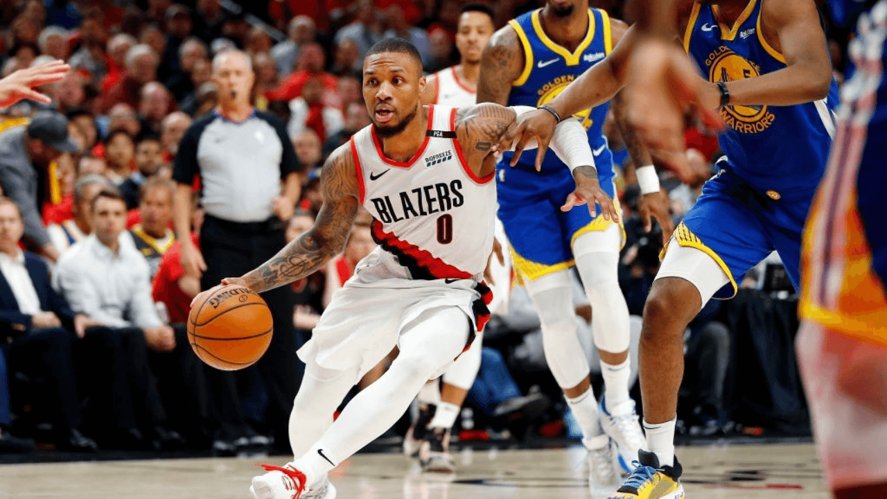 PORTLAND, OREGON - MAY 20: Damian Lillard #0 of the Portland Trail Blazers handles the ball during the second half against the Golden State Warriors in game four of the NBA Western Conference Finals at Moda Center on May 20, 2019 in Portland, Oregon. NOTE TO USER: User expressly acknowledges and agrees that, by downloading and or using this photograph, User is consenting to the terms and conditions of the Getty Images License Agreement. (Photo by Jonathan Ferrey/Getty Images)