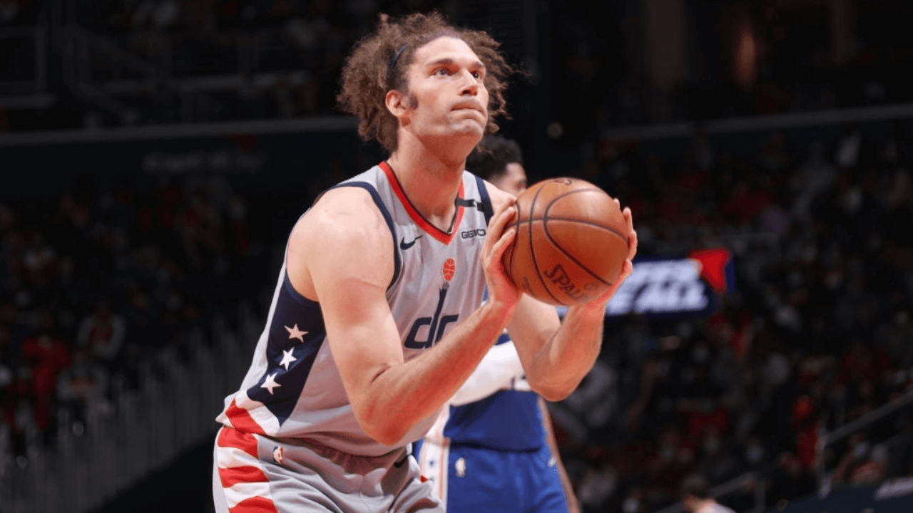 WASHINGTON, DC - MAY 29: Robin Lopez #15 of the Washington Wizards prepares to shoot a free throw against the Philadelphia 76ers during Round 1, Game 3 of the 2021 NBA Playoffs on May 29, 2021 at Capital One Arena in Washington, DC. NOTE TO USER: User expressly acknowledges and agrees that, by downloading and or using this Photograph, user is consenting to the terms and conditions of the Getty Images License Agreement. Mandatory Copyright Notice: Copyright 2021 NBAE (Photo by Stephen Gosling/NBAE via Getty Images)