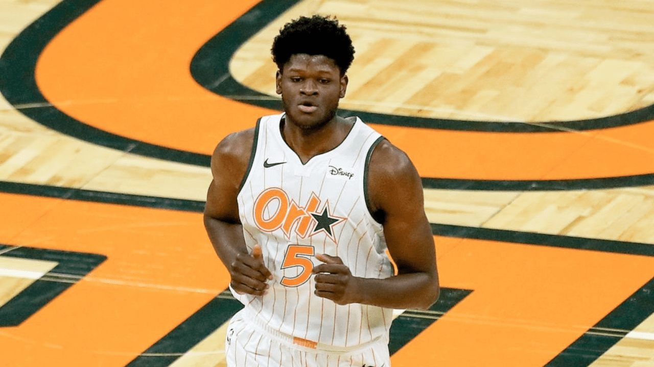ORLANDO, FL - APRIL 22: Mo Bamba #5 of the Orlando Magic watches the action against the New Orleans Pelicans at Amway Center on April 22, 2021 in Orlando, Florida. NOTE TO USER: User expressly acknowledges and agrees that, by downloading and or using this photograph, User is consenting to the terms and conditions of the Getty Images License Agreement. (Photo by Alex Menendez/Getty Images)