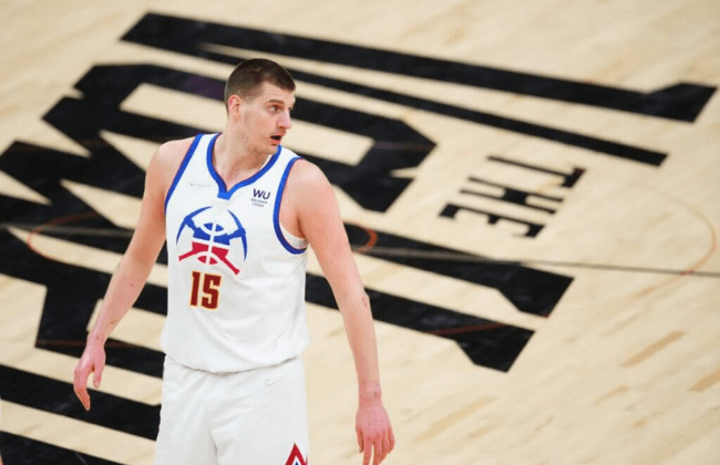 Jun 9, 2021; Phoenix, Arizona, USA; Denver Nuggets center Nikola Jokic (15) against the Phoenix Suns during game two in the second round of the 2021 NBA Playoffs at Phoenix Suns Arena. Mandatory Credit: Mark J. Rebilas-USA TODAY Sports