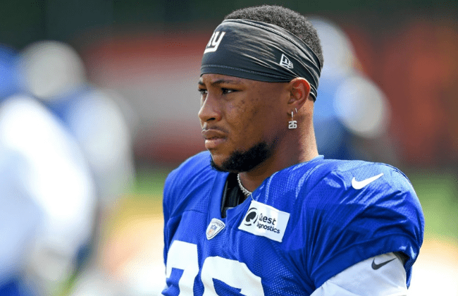 BEREA, OH - AUGUST 19: Saquon Barkley #26 of the New York Giants looks on during a joint practice with the Cleveland Browns on August 19, 2021 in Berea, Ohio. (Photo by Nick Cammett/Getty Images)
