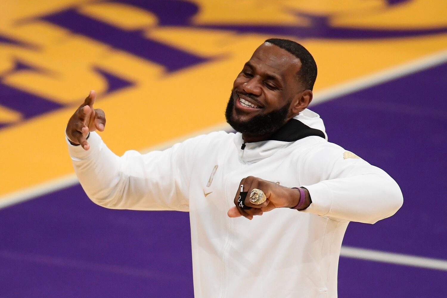 LOS ANGELES, CALIFORNIA - DECEMBER 22: LeBron James #23 of the Los Angeles Lakers reacts after receiving his 2020 NBA championship ring during a ceremony before the opening night game against the Los Angeles Clippers at Staples Center on December 22, 2020 in Los Angeles, California.