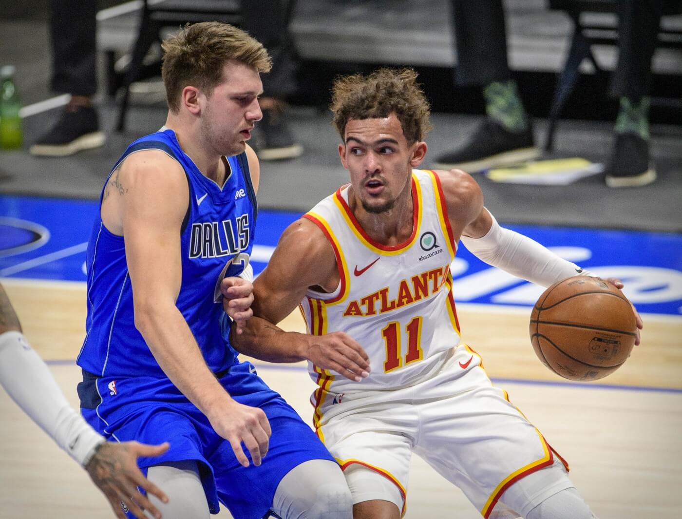 Feb 10, 2021; Dallas, Texas, USA; Dallas Mavericks guard Luka Doncic (77) defends against Atlanta Hawks guard Trae Young (11) during the first quarter at the American Airlines Center. Mandatory Credit: Jerome Miron-USA TODAY Sports