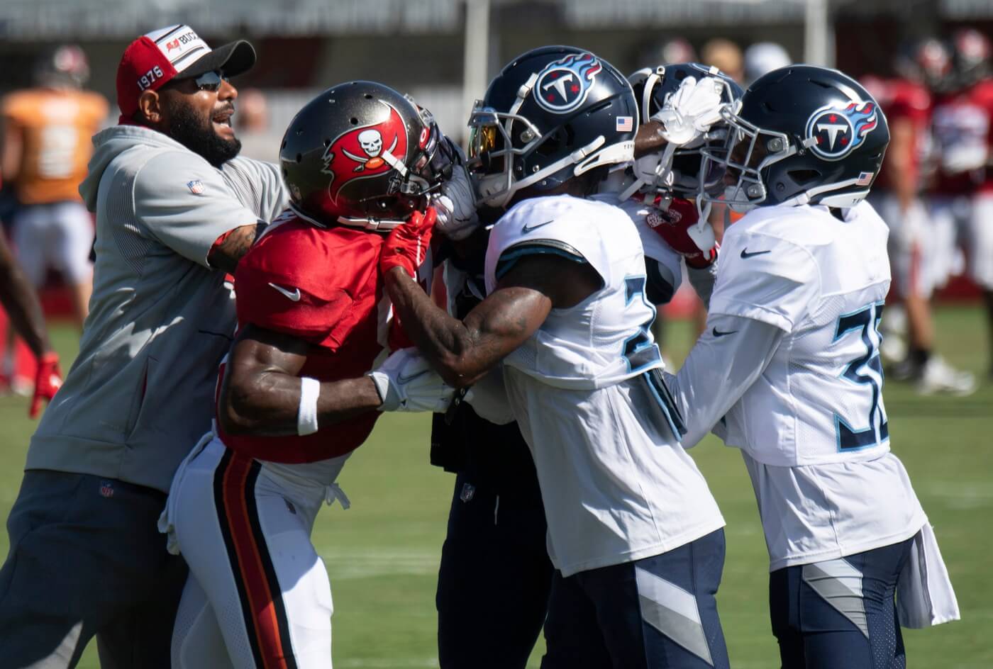 Tampa Bay Buccaneers wide receiver Antonio Brown (81) fights with Tennessee Titans defensive back Chris Jackson (35) during a joint training camp practice at AdventHealth Training Center Thursday, Aug. 19, 2021 in Tampa, Fla. Nas Titans Bucs 006