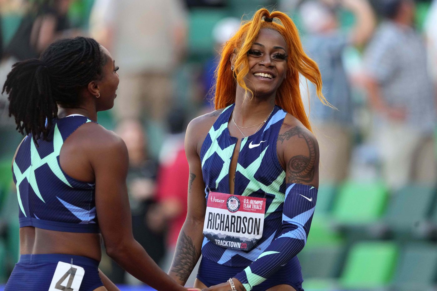 Jun 19, 2021; Eugene, OR, USA; Sha'Carri Richardson (right) celebrates with Javianne Oliver after winning the women's 100m in 10.86 during the US Olympic Team Trials at Hayward Field. Mandatory Credit: Kirby Lee-USA TODAY Sports