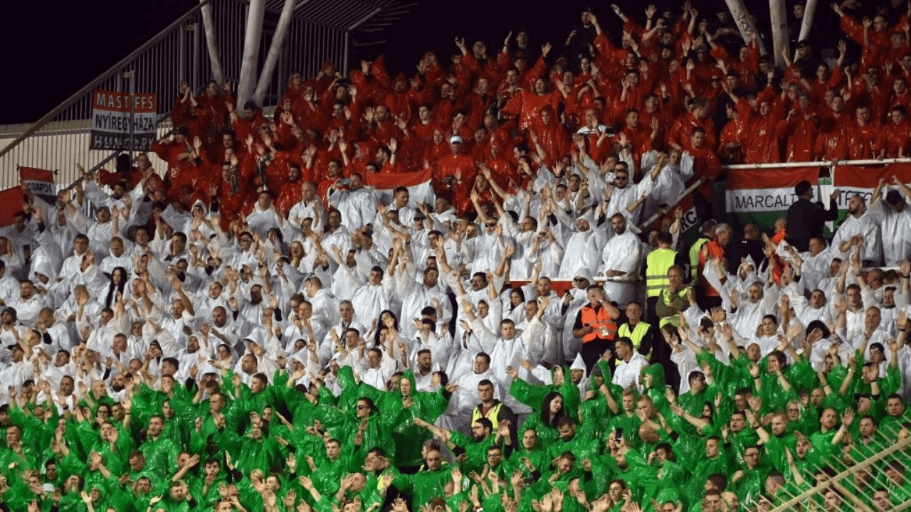 TOPSHOT - Hungary's supporters cheer their team during the Euro 2020 football qualification match between Croatia and Hungary in Split, Croatia on October 10, 2019. (Photo by Denis LOVROVIC / AFP) (Photo by DENIS LOVROVIC/AFP via Getty Images)
