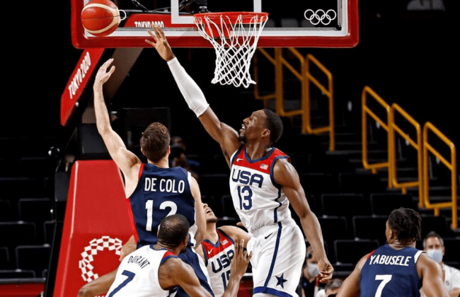 Aug 7, 2021; Saitama, Japan; France shooting guard Nando de Colo (12) shoots the ball against United States centre Bam Adebayo (13) in the men's basketball gold medal game during the Tokyo 2020 Olympic Summer Games at Saitama Super Arena. Mandatory Credit: Geoff Burke-USA TODAY Sports