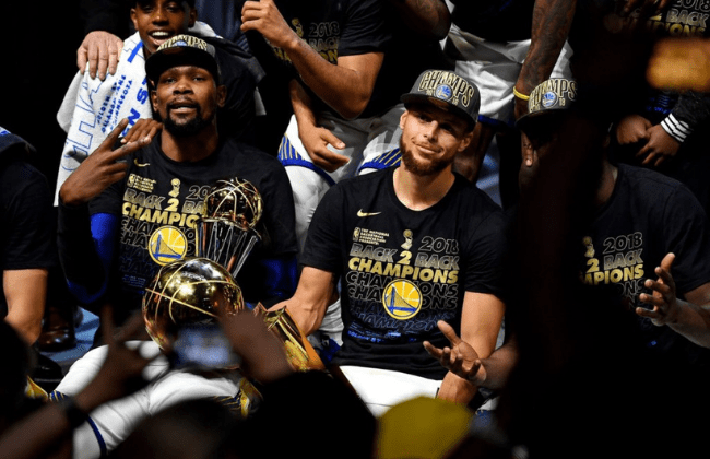 OAKLAND, CA - JUNE 12: Klay Thompson #11, Stephen Curry #30, Kevin Durant #35 and Draymond Green #23 of the Golden State Warriors pose for a team photo after winning the NBA Championship and defeating the Cleveland Cavaliers in Game Five of the 2017 NBA Finals on June 12, 2017 at ORACLE Arena in Oakland, California. NOTE TO USER: User expressly acknowledges and agrees that, by downloading and or using this photograph, user is consenting to the terms and conditions of Getty Images License Agreement. Mandatory Copyright Notice: Copyright 2017 NBAE (Photo by Garrett Ellwood/NBAE via Getty Images)