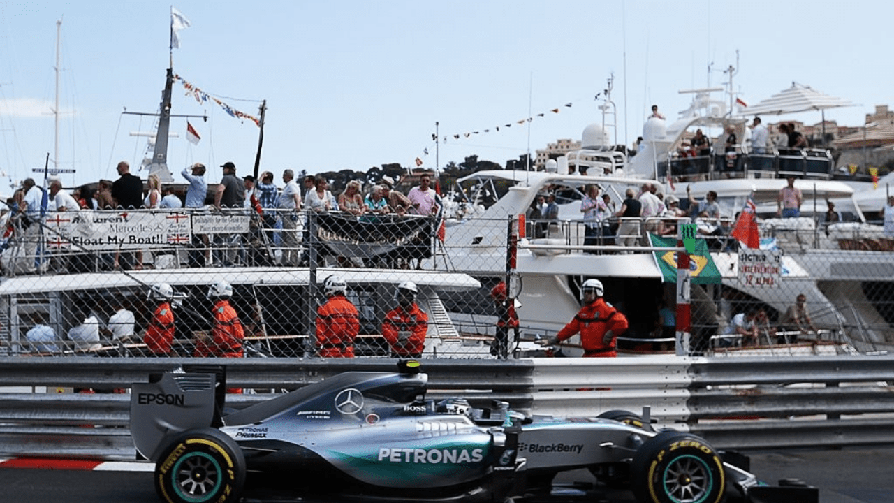 Mercedes AMG Petronas F1 Team's German driver Nico Rosberg drives past spectators aboard yachts at the Monaco street circuit in Monte-Carlo on May 24, 2015, during the Monaco Formula One Grand Prix. AFP PHOTO / JEAN CHRISTOPHE MAGNENET (Photo credit should read JEAN CHRISTOPHE MAGNENET/AFP via Getty Images)