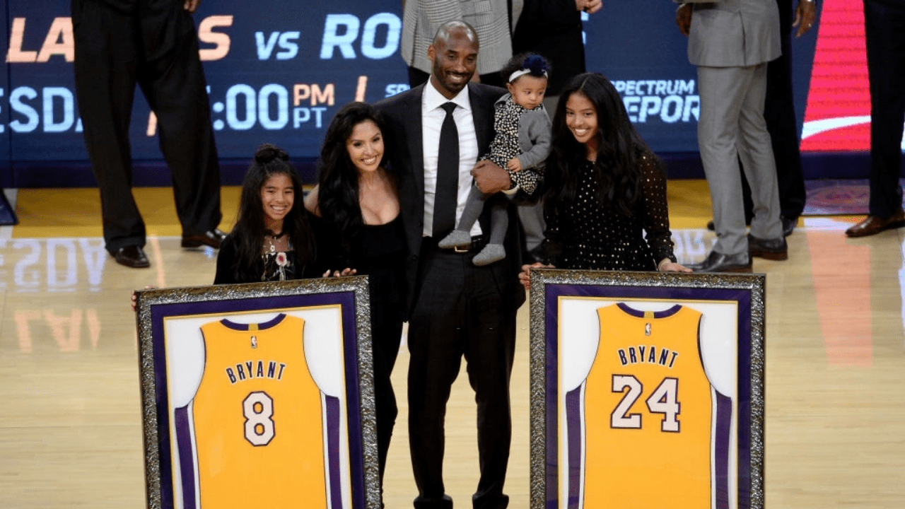 LOS ANGELES, CA - DECEMBER 18: Kobe Bryant poses with his family at halftime after both his #8 and #24 Los Angeles Lakers jerseys are retired at Staples Center on December 18, 2017 in Los Angeles, California. NOTE TO USER: User expressly acknowledges and agrees that, by downloading and or using this photograph, User is consenting to the terms and conditions of the Getty Images License Agreement. (Photo by Maxx Wolfson/Getty Images)