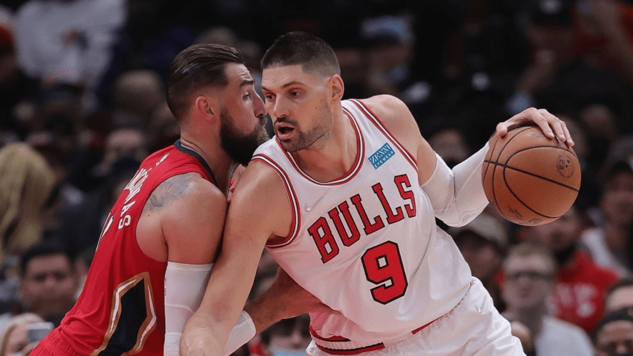 CHICAGO, ILLINOIS - OCTOBER 22: Nikola Vucevic #9 of the Chicago Bulls drives against Jonas Valanciunas #17 of the New Orleans Pelicans at the United Center on October 22, 2021 in Chicago, Illinois. The Bulls defeated the Pelicans 128-112. NOTE TO USER: User expressly acknowledges and agrees that, by downloading and or using this photograph, User is consenting to the terms and conditions of the Getty Images License Agreement. (Photo by Jonathan Daniel/Getty Images)
