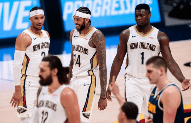 Mar 21, 2021; Denver, Colorado, USA; New Orleans Pelicans forward Brandon Ingram (14) reacts with guard Josh Hart (3) and forward Zion Williamson (1) in the fourth quarter against the Denver Nuggets at Ball Arena. Mandatory Credit: Isaiah J. Downing-USA TODAY Sports