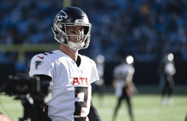 Dec 12, 2021; Charlotte, North Carolina, USA; Atlanta Falcons quarterback Matt Ryan (2) looks downfield from the sidelines during the second half of the game against the Carolina Panthers at Bank of America Stadium. Mandatory Credit: William Howard-USA TODAY Sports