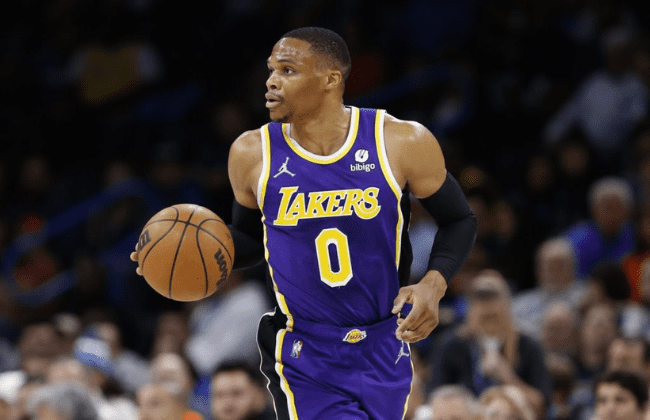 Dec 10, 2021; Oklahoma City, Oklahoma, USA; Los Angeles Lakers guard Russell Westbrook (0) dribbles the ball down the court against the Oklahoma City Thunder during the first quarter at Paycom Center. Mandatory Credit: Alonzo Adams-USA TODAY Sports