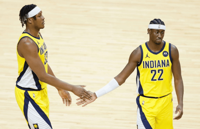 MIAMI, FLORIDA - MARCH 19: Myles Turner #33 and Caris LeVert #22 of the Indiana Pacers high five against the Miami Heat during the first quarter at American Airlines Arena on March 19, 2021 in Miami, Florida. NOTE TO USER: User expressly acknowledges and agrees that, by downloading and or using this photograph, User is consenting to the terms and conditions of the Getty Images License Agreement.  (Photo by Michael Reaves/Getty Images)