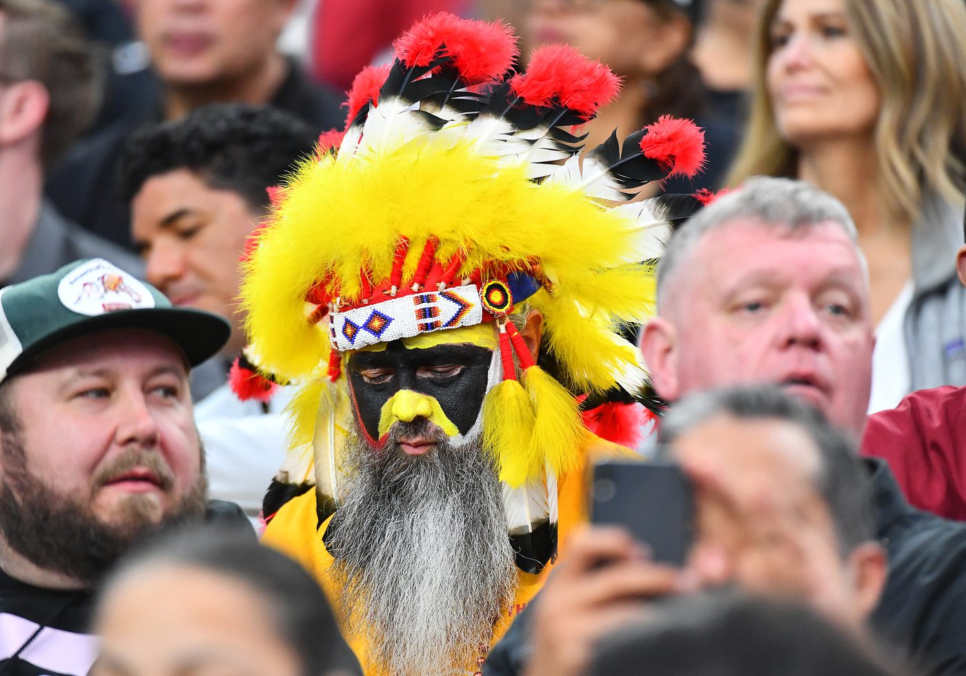 Dec 5, 2021; Paradise, Nevada, USA; A fan dressed in a Native American costume looks on from the stands during a game between the Las Vegas Raiders and the Washington Football Team at Allegiant Stadium. Mandatory Credit: Stephen R. Sylvanie-USA TODAY Sports