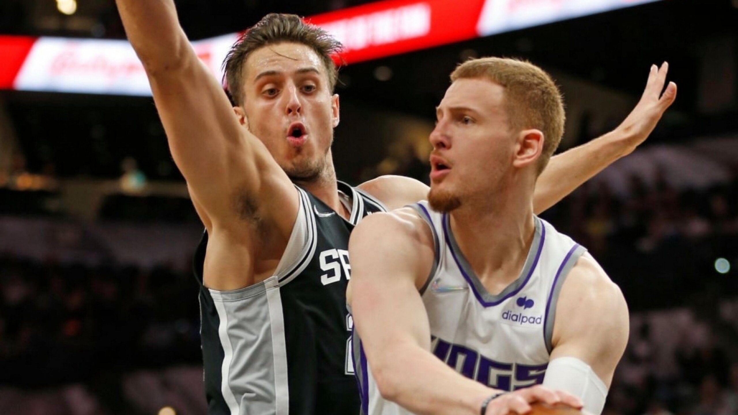SAN ANTONIO, TX - MARCH 3: Donte DiVencenzo #0 of the Sacramento Kings drives pat Zach Collins #23 of the San Antonio Spursin the second half at AT&T Center on March 3, 2022 in San Antonio, Texas. NOTE TO USER: User expressly acknowledges and agrees that, by downloading and or using this photograph, User is consenting to terms and conditions of the Getty Images License Agreement. (Photo by Ronald Cortes/Getty Images)
