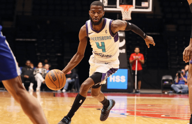 UNIONDALE, NY - DECEMBER 27: Jalen Crutcher #4 of the Greensboro Swarm dribbling the ball during the game against the Long Island Nets on December 27, 2022 in Uniondale, NY. NOTE TO USER: User expressly acknowledges and agrees that, by downloading and/or using this photograph, user is consenting to the terms and conditions of the Getty Images License Agreement. Mandatory Copyright Notice: Copyright 2022 NBAE (Photo by Luther Schlaifer/NBAE via Getty Images)