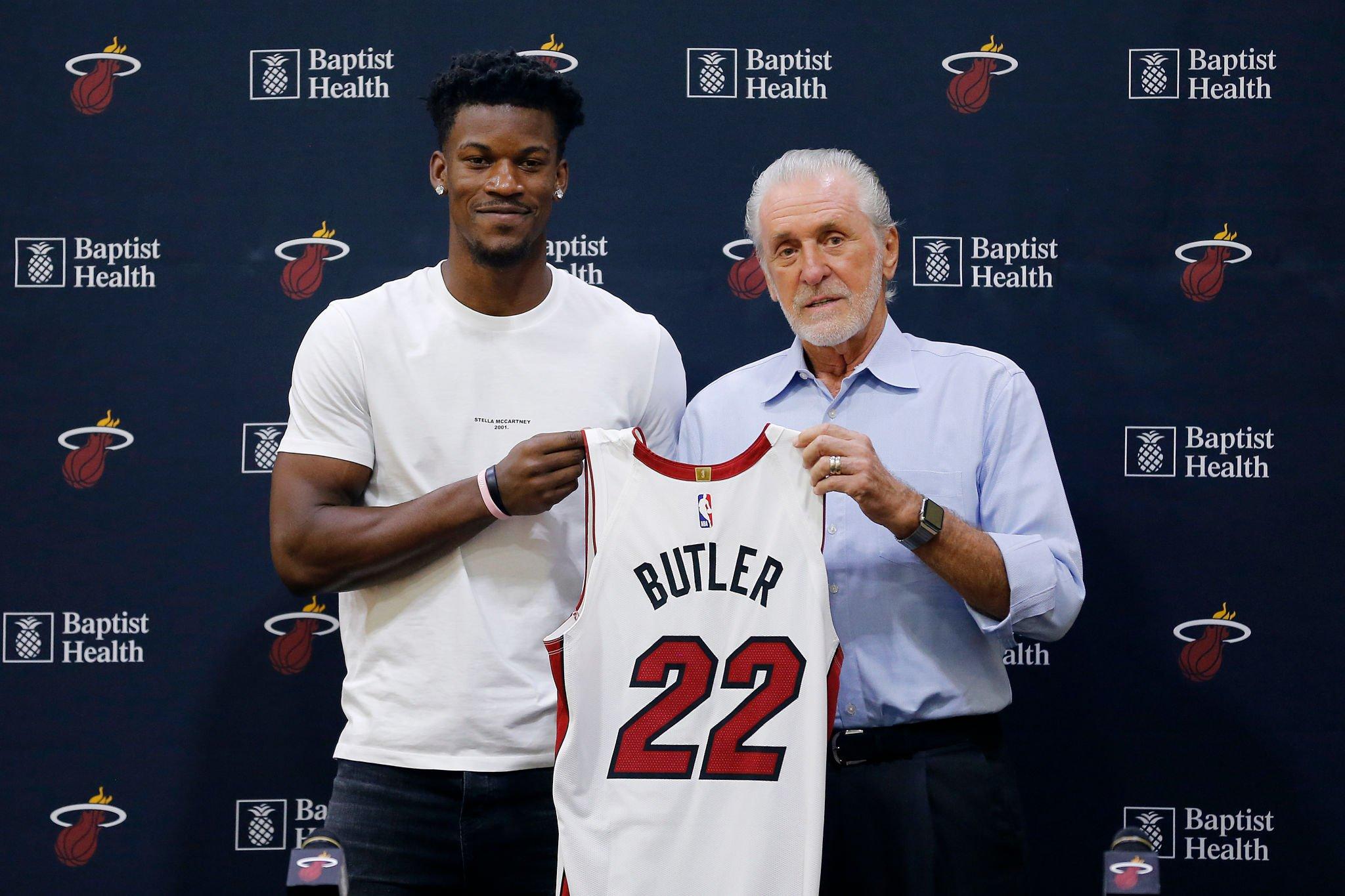 MIAMI, FLORIDA - SEPTEMBER 27: Jimmy Butler #22 of the Miami Heat poses for a photo with president Pat Riley during his introductory press conference at American Airlines Arena on September 27, 2019 in Miami, Florida. NOTE TO USER: User expressly acknowledges and agrees that, by downloading and or using this photograph, User is consenting to the terms and conditions of the Getty Images License Agreement. (Photo by Michael Reaves/Getty Images)