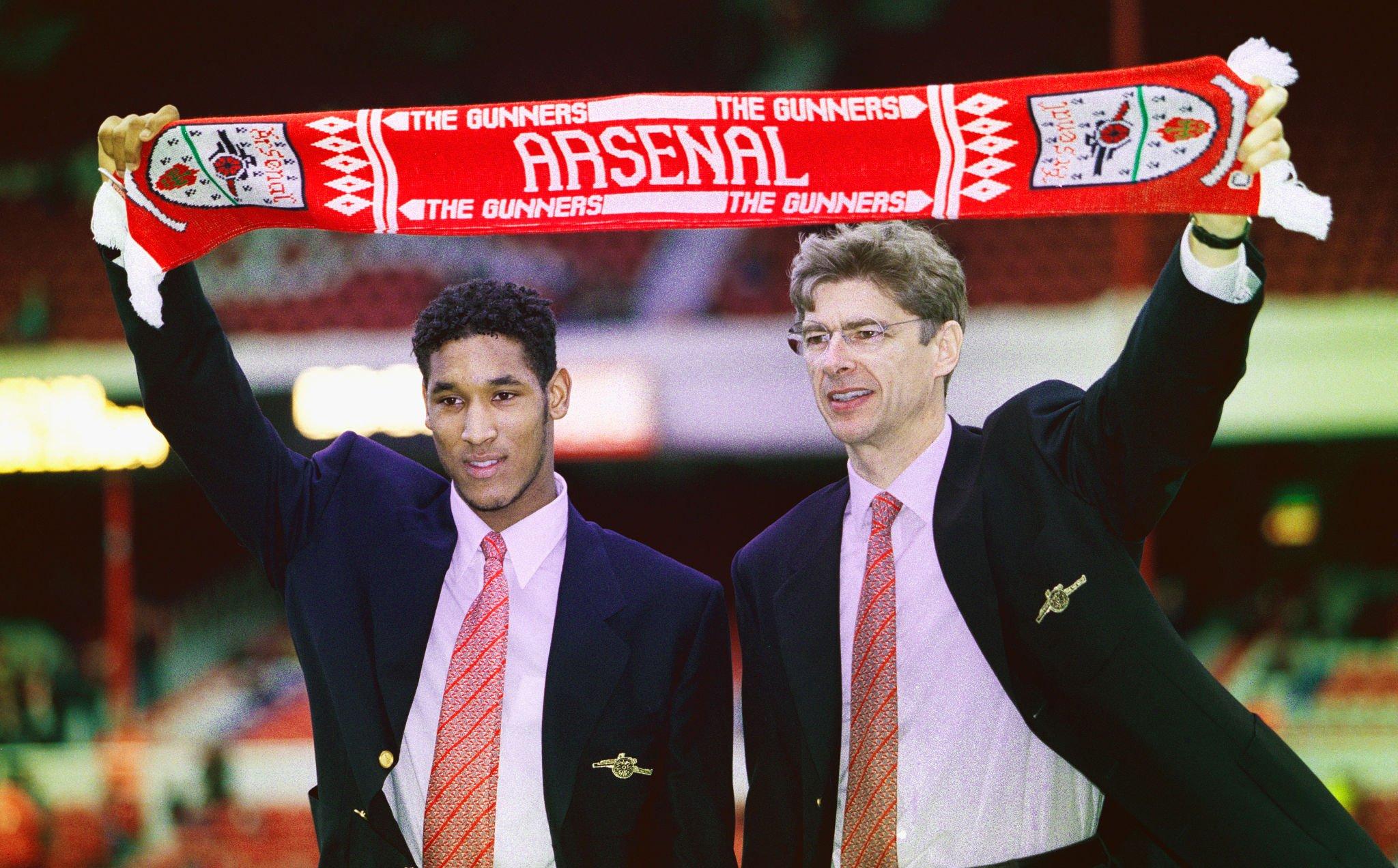 LONDON, UNITED KINGDOM - FEBRUARY 24: Arsenal manager Arsene Wenger (r) and new signing Nicolas Anelka pictured before an FA Carling Premiership match between Arsenal and Wimbledon at Highbury on February 24, 1997 in London, England. (Photo by Ben Radford/Allsport/Getty Images)