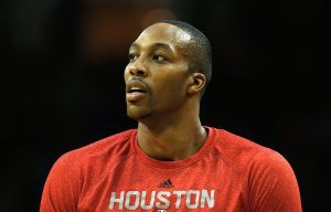HOUSTON, TX - JANUARY 24: Dwight Howard #12 of the Houston Rockets waits on the court before the game against the Memphis Grizzlies at the Toyota Center on January 24, 2014 in Houston, Texas. NOTE TO USER: User expressly acknowledges and agrees that, by downloading and or using this photograph, User is consenting to the terms and conditions of the Getty Images License Agreement. (Photo by Scott Halleran/Getty Images)
