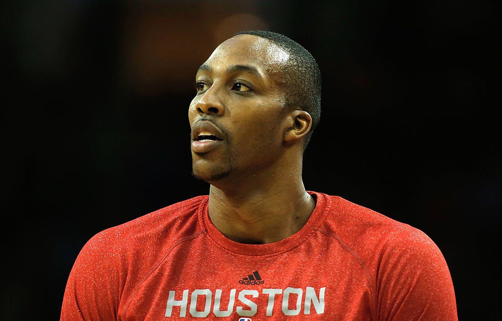 HOUSTON, TX - JANUARY 24: Dwight Howard #12 of the Houston Rockets waits on the court before the game against the Memphis Grizzlies at the Toyota Center on January 24, 2014 in Houston, Texas. NOTE TO USER: User expressly acknowledges and agrees that, by downloading and or using this photograph, User is consenting to the terms and conditions of the Getty Images License Agreement. (Photo by Scott Halleran/Getty Images)