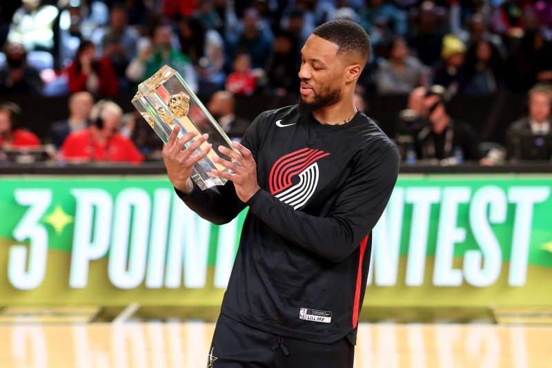SALT LAKE CITY, UTAH - FEBRUARY 18: Damian Lillard #0 of the Portland Trail Blazers celebrates with the trophy after winning the 2023 NBA All Star Starry 3-Point Contest at Vivint Arena on February 18, 2023 in Salt Lake City, Utah. NOTE TO USER: User expressly acknowledges and agrees that, by downloading and or using this photograph, User is consenting to the terms and conditions of the Getty Images License Agreement. (Photo by Tim Nwachukwu/Getty Images)