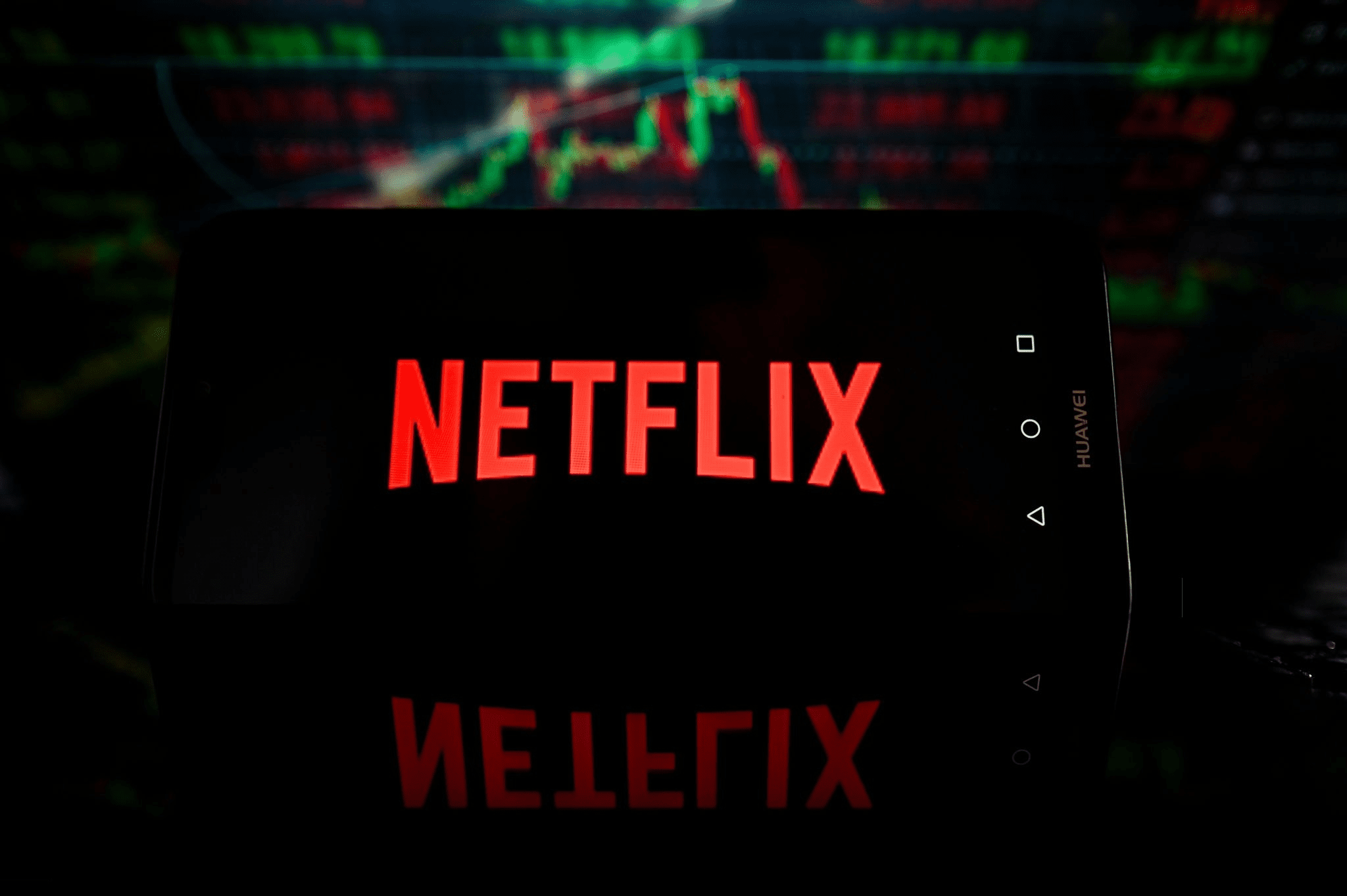 POLAND - 2023/10/19: In this photo illustration a Netflix logo is displayed on a smartphone with stock market percentages on the background. (Photo Illustration by Omar Marques/SOPA Images/LightRocket via Getty Images)