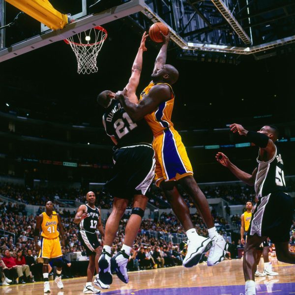 LOS ANGELES, CA - 2000: Shaquille O'Neal #34 of the Los Angeles Lakers dunks the ball against Tim Duncan #21 of the San Antonio Spurs circa 2000 at Staples Center in Los Angeles, CA. NOTE TO USER: User expressly acknowledges and agrees that, by downloading and/or using this photograph, user is consenting to the terms and conditions of the Getty Images License Agreement. Mandatory Copyright Notice: Copyright 2000 NBAE (Photo by Robert Mora/NBAE via Getty Images)