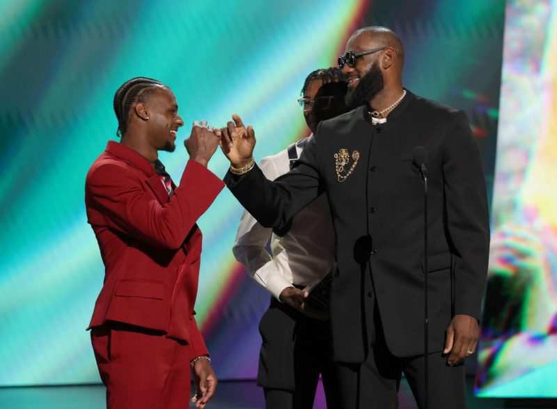 HOLLYWOOD, CALIFORNIA - JULY 12: (L-R) Bronny James and Bryce James present the LeBron James with the Best Record-Breaking Performance award onstage during The 2023 ESPY Awards at Dolby Theatre on July 12, 2023 in Hollywood, California. (Photo by Kevin Mazur/Getty Images)