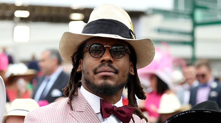 NFL player Cam Newton watches an undercard race before the running of the 148th Kentucky Derby at Churchill Downs on May 7, 2022, in Louisville. (Gunnar Word/Getty Images)