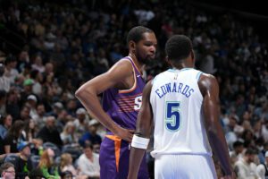 MINNEAPOLIS, MN - APRIL 14: Kevin Durant #35 of the Phoenix Suns and Anthony Edwards #5 of the Minnesota Timberwolves speak during the game on April 14, 2024 at Target Center in Minneapolis, Minnesota. NOTE TO USER: User expressly acknowledges and agrees that, by downloading and or using this Photograph, user is consenting to the terms and conditions of the Getty Images License Agreement. Mandatory Copyright Notice: Copyright 2024 NBAE (Photo by Jordan Johnson/NBAE via Getty Images)