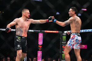 LAS VEGAS, NEVADA - APRIL 13: (L-R) Justin Gaethje and Max Holloway touch gloves in a lightweight fight during the UFC 300 event at T-Mobile Arena on April 13, 2024 in Las Vegas, Nevada. (Photo by Chris Unger/Zuffa LLC via Getty Images)