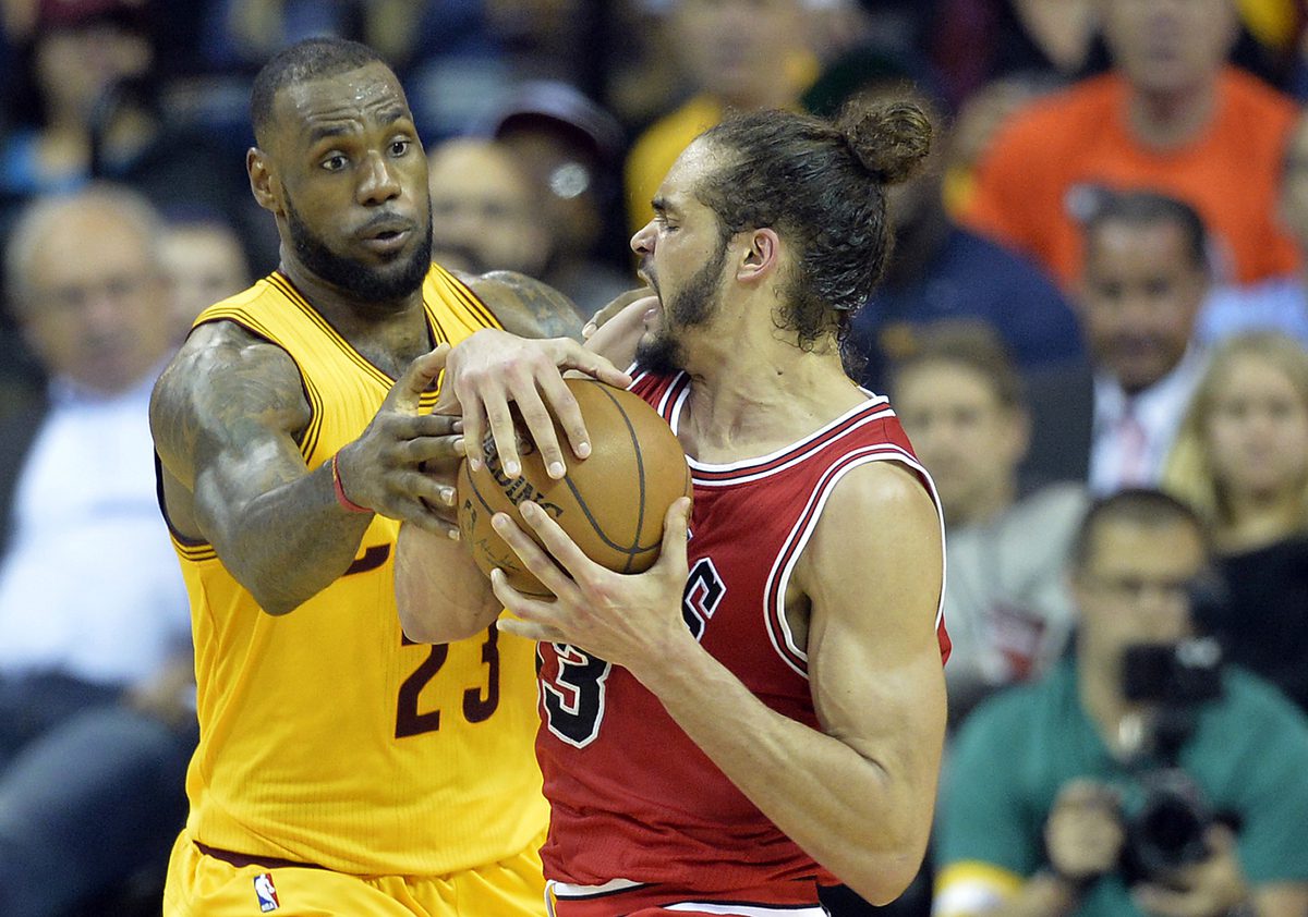 May 12, 2015; Cleveland, OH, USA; Cleveland Cavaliers forward LeBron James (23) defends Chicago Bulls center Joakim Noah (13) in the second quarter in game five of the second round of the NBA Playoffs at Quicken Loans Arena. Mandatory Credit: David Richard-USA TODAY Sports